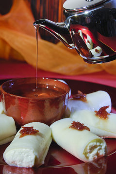 Pouring Syrup on Halawa Jubon, Arabic Sweets for Ramadan and Eid