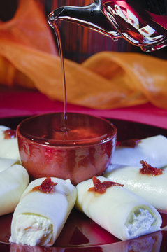 Pouring Syrup on Halawa Jubon, Arabic Sweets for Ramadan and Eid