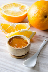 Orange jam served in spoon on the table