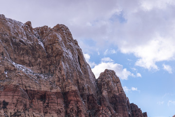 Snowy rocky edge with dark skys