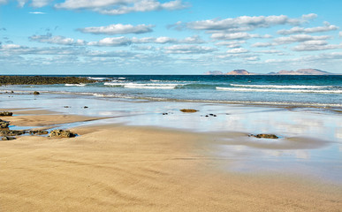 Landscape with volcanic hills and atlantic ocean in Lanzarote