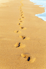 Footprints in the sand beach road in dune