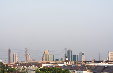 Fototapeta na wymiar Thailand's capital, Bangkok, seen from afar, high voltage towers and high speed rail construction.
