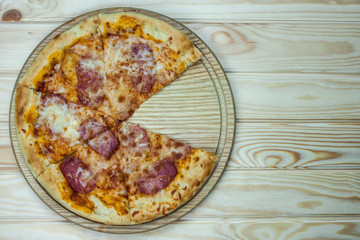 Pizza served on wooden table