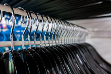 Hangers close-up. Clothes hangers in fashion store. Clothes business concept