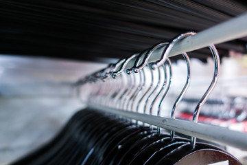 Hangers close-up. Clothes hangers in fashion store. Clothes business concept