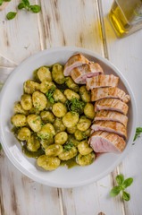 Pork tenderloin with herbs and spices, pesto gnocchi