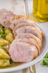 Pork tenderloin with herbs and spices, pesto gnocchi