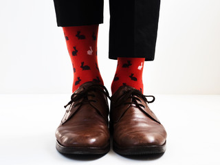Men's legs in bright, funny socks and stylish shoes