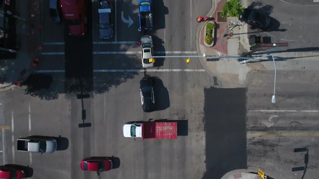 Aerial overhead looking down at police on the scene of a car wreck.