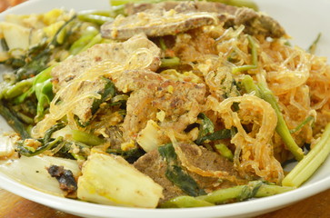 fried glass noodles with pork and vegetable on plate