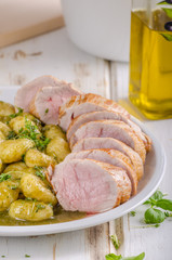 Pork tenderloin with herbs and spices, pesto gnocchi