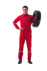 Young tyre repairman in red coveralls isolated on white backgrou