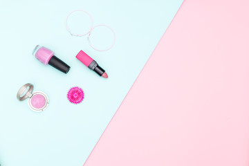 Women's Accessories and Cosmetics on pastel color background. Copy space