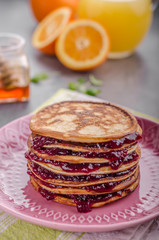 Pancakes strawberry, sugar and jam