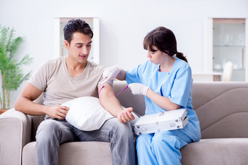 Patient getting blood transfusion in hospital clinic