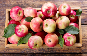 fresh red apples with leaves