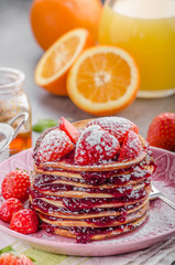 Pancakes strawberry, sugar and jam
