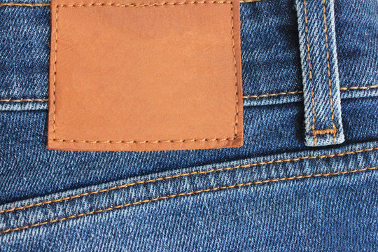 Denim Blue Jeans Empty Leather Label on Back Side. Pair of Classic Modern  Style Clothing Blue Jeans. Close Up View of Casual Wear Apparel and Blank  Leather Label Tag Copy Space for