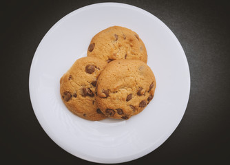 Cookies with chocolate. Color toned. Selective focus.