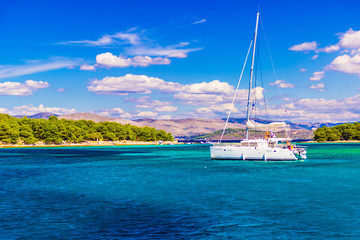 Aerial view of cozy mediterranean island. Blue lagoon, island paradise. Adriatic Sea of Croatia, popular touristic destination. Clear sea water.