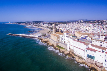 Sitges with a parish churh Sat Bartolome i Santa Tecla. Aerial view.