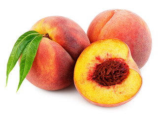 Group of peaches with peach half and green leaves isolated on white background with clipping path
