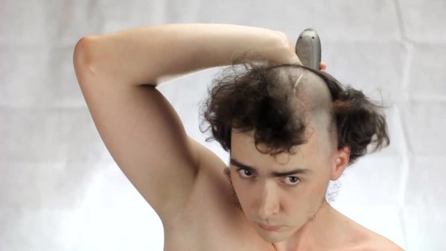 A man shaves head, the Overdrive mode