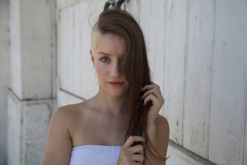 Fototapeta premium portrait of a beautiful young girl with make up outside