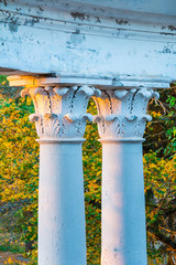 Columns of the abandoned building of the former restaurant on the top of Mount Akhun in sunny autumn day, Sochi, Russia
