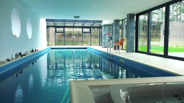 An indoor swimming pool and bath in a luxurious house