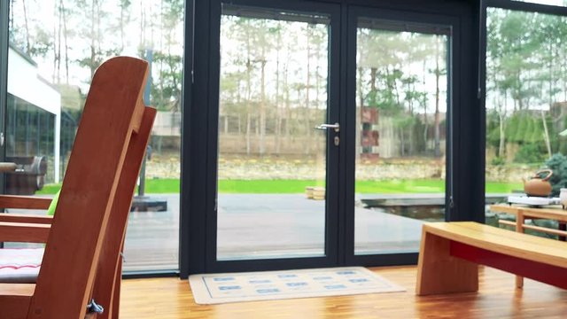 An interior of a luxurious house and the view on the backyard
