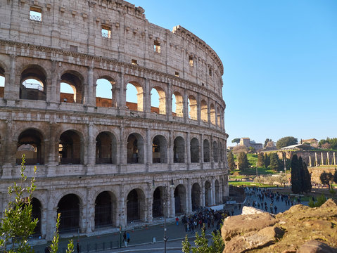 Colosseum, also known as the Flavian Amphitheatre with tourists in Rome, Italy