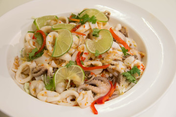 Spicy squid salad on the plate