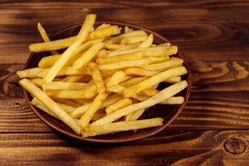 French fries on wooden table