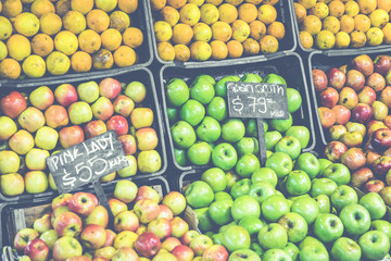 Market stall with tropical fruits and vegetables.