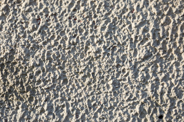 Old stone wall made up of pebbles. Pattern gray color of modern style design decorative uneven round real stone wall surface with cement. Wall design for huts made from mountain river rocks.