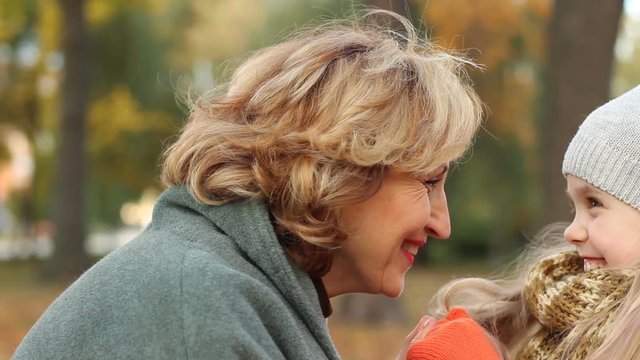 Two generation: delighted, smiling grandmother, meeting with granddaughter