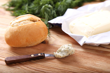 Fresh garlic bun with butter and greens