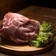 Raw pork meat on wooden board
