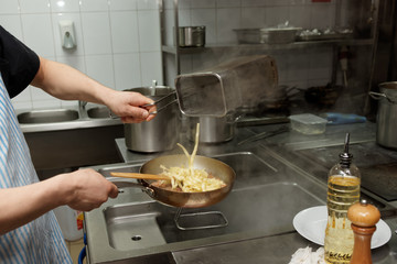 Chef is cooking pasta