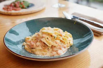 Pasta carbonara on restaurant table