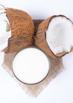 Coconut with coconut milk isolated on white background.