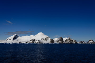 Rocks with snow in sea