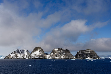 Rocks with snow in sea