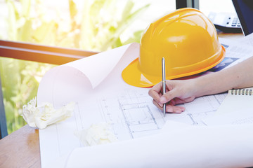 Engineer woman and Architect drawings blueprint at Construction,Site.Home Project
