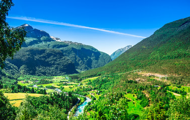 View on green calley landscape and mountain creek in Norway