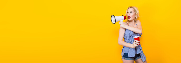 Blonde woman in blue striped blouse with megaphone
