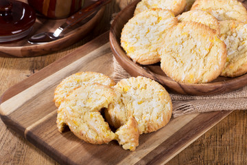 Lemon crackle cookies on a wooden tray and plate