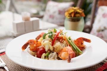 Shrimp appetizer, light summer dish on table oudoors